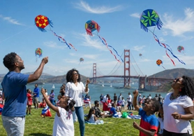 Family flying kites in San Francisco