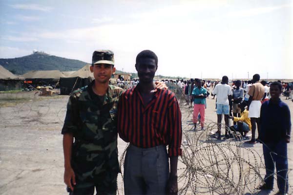 Marcel at Guantanamo with Haitian refugee